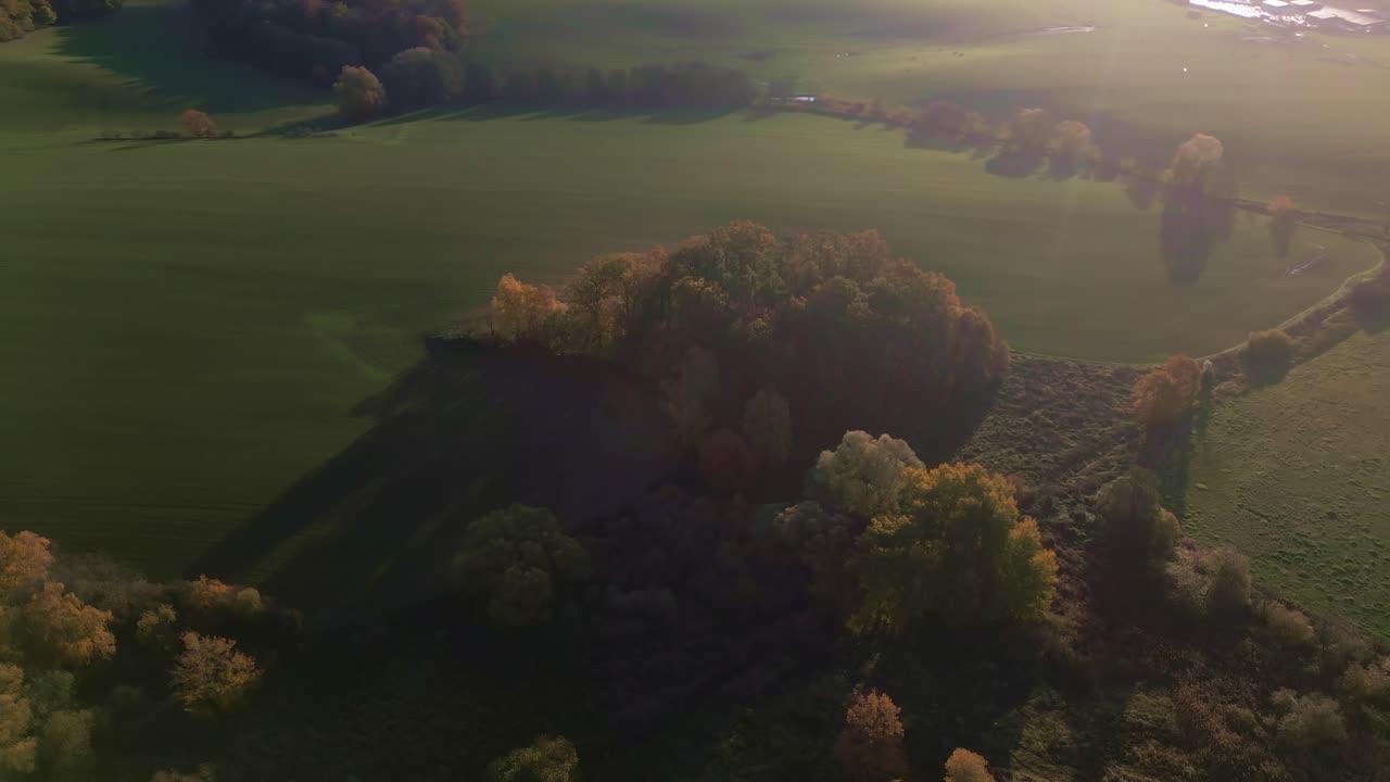Morning autumn sun glows over Moravian rural farming countryside Aerial