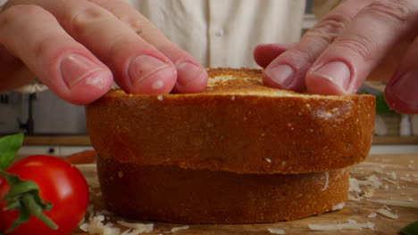 making a gourmet ham and cheese sandwich