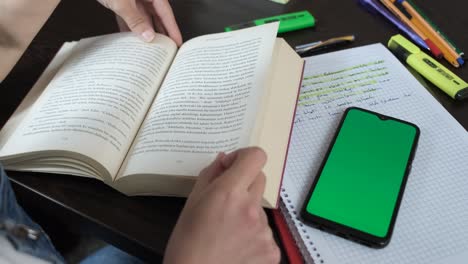 Book-and-green-screen-phone