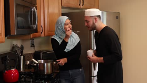 middle eastern young couple with soup he sips static