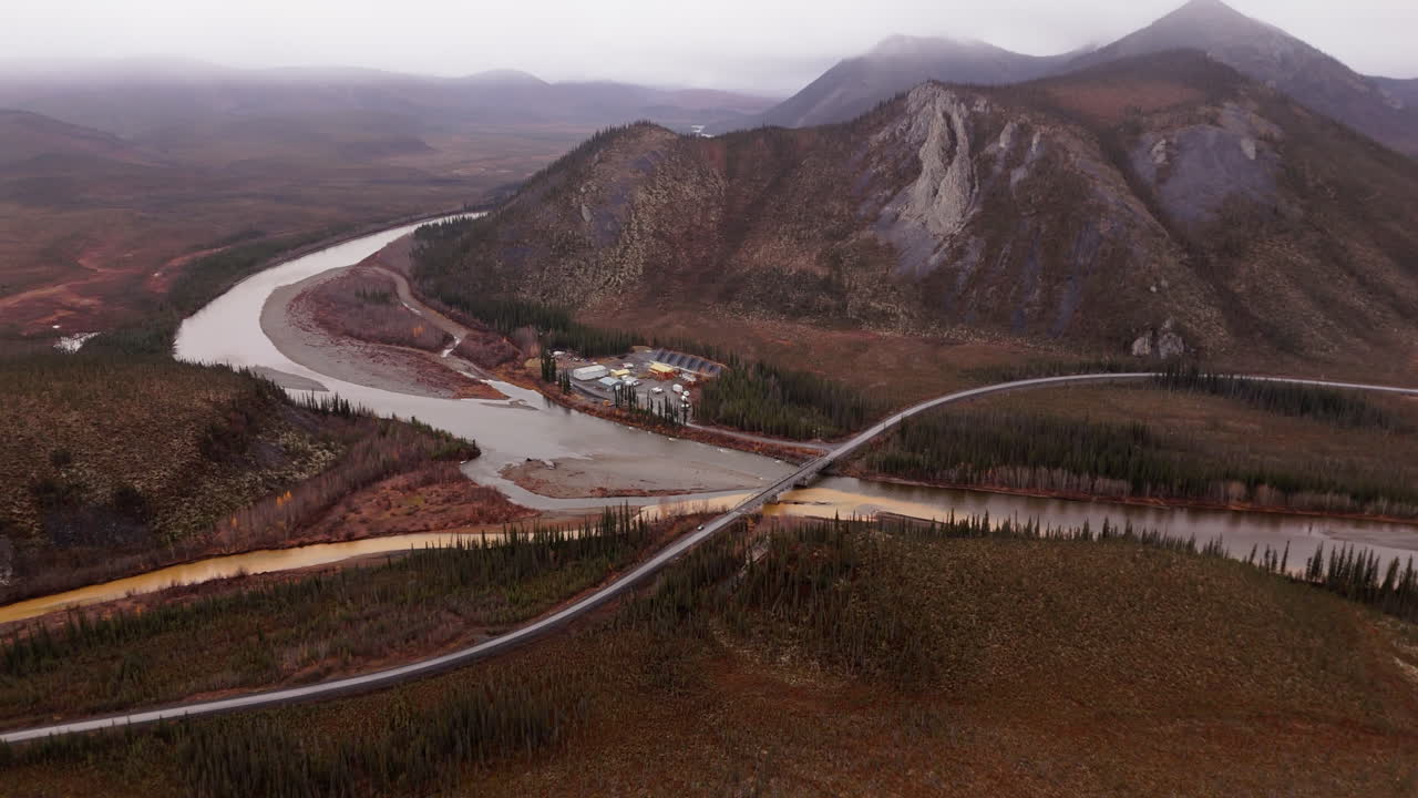 Aerial View Of River Road Bridge On The Dempster Highway With Ogilvie Mountains In Yukon Canada.