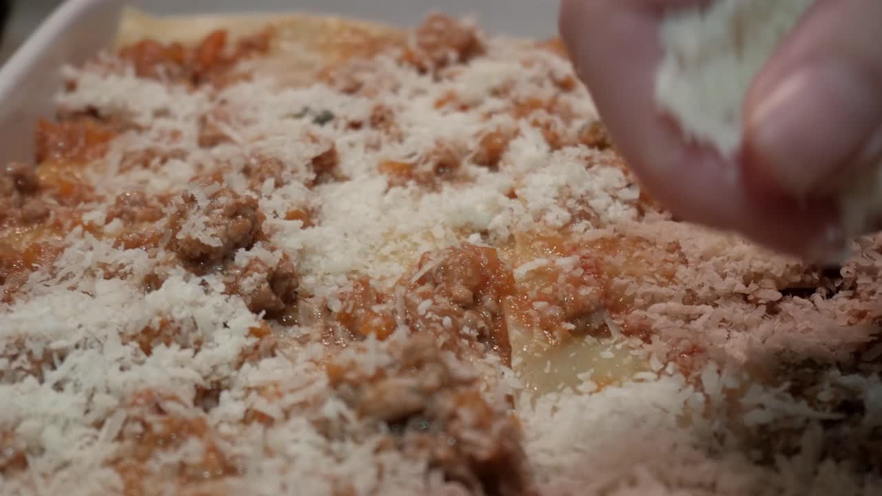 Freshly baked lasagna topped with cheese and meat sauce, ready to serve