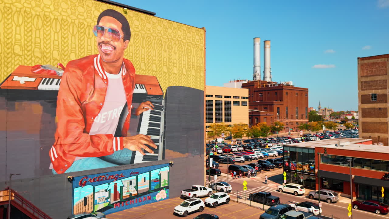 Detroit, USA, 28 July 2025: Parking lot near the building with a big mural. The Stevie Wonder mural outside Music Hall Center for the Performing Arts downtown Detroit, Michigan, USA