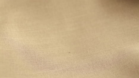 wedding gold rings dropped on white cloth background. jewelry for weddings.