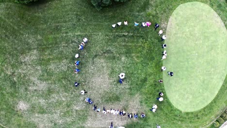 Newlywed-couple-having-first-dance,-circle-of-people-around,-overhead