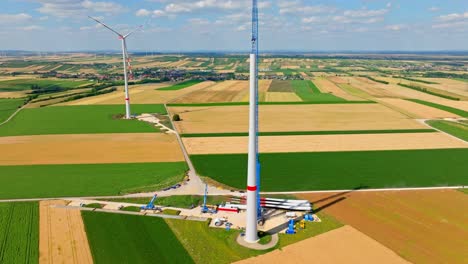 wind turbine under construction in austria - aerial drone shot