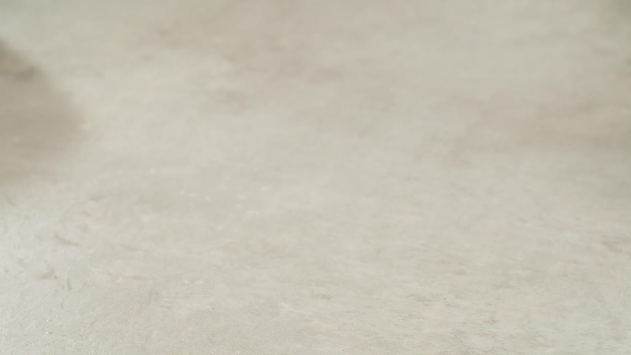 Fried tofu with sesame seeds and spices on cast iron pan, cooking japanese salad. Healthy ingredient for cooking vegan vegetarian diet food. Roasted tofu over black background.