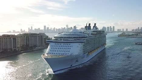 aerial shot of huge luxury cruise ship leaving port of miami at sunset, miami beach, flordia usa hd