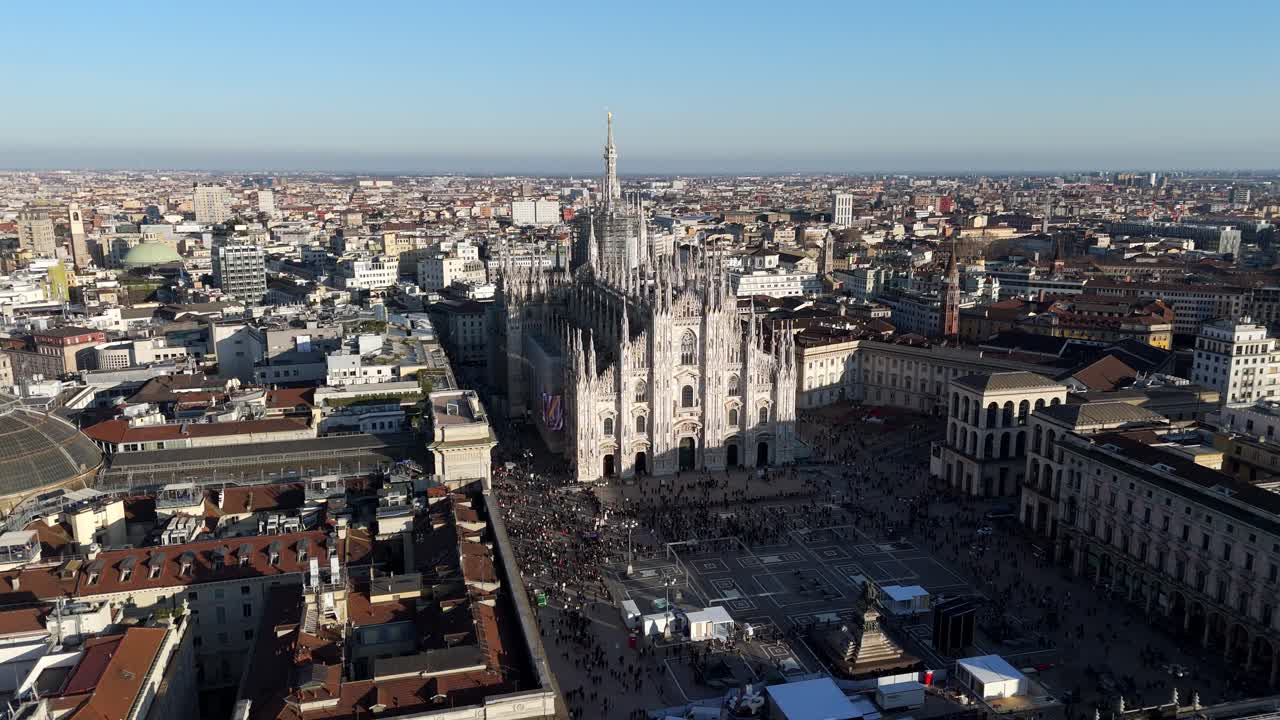 Duomo Milan main square cathedral aerial drone fly above revealing cityscape
