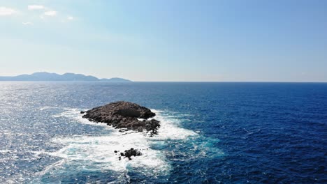 small rocky island of saint jerusalem amidst the ionian sea in kefalonia, greece