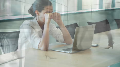 Animation-of-busy-people-walking-over-tired-caucasian-businesswoman-in-office