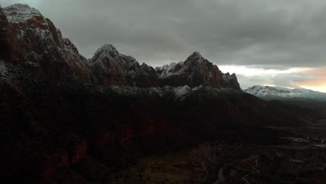 snow-covered mountains in zion national park at sunset