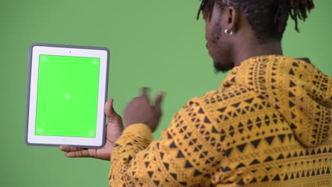 young handsome african man using digital tablet
