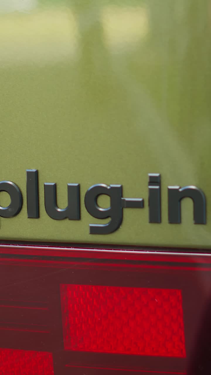Vertical video Close up shot of plug in electric vehicle with rechargeable battery packs