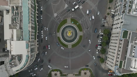 aerial down shot of cars driving around the st