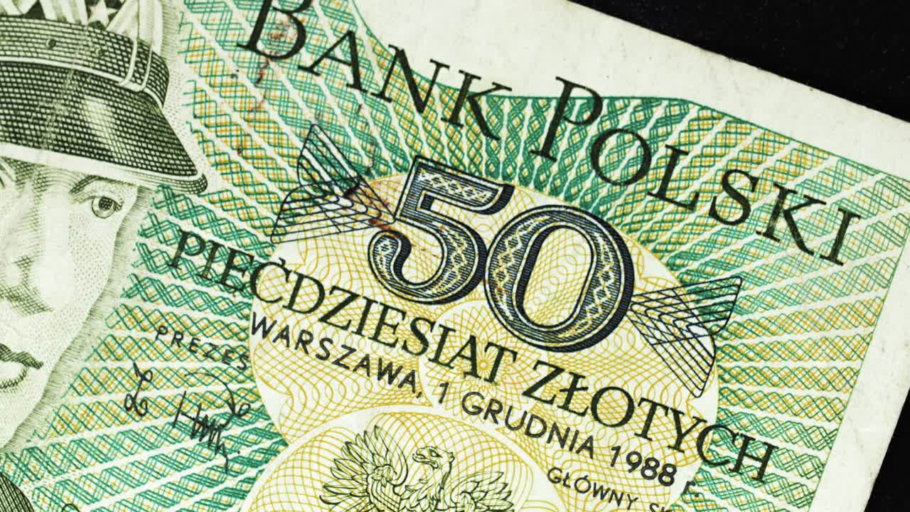 Poland 1988 50 Zlotych banknote obverse with military portrait and Bank Polski text rotating on black background
