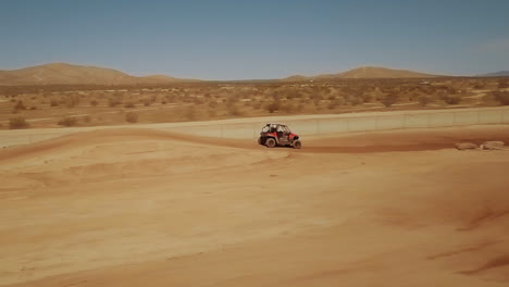 slowmo off road racing in california city scenic desert, tracking shot