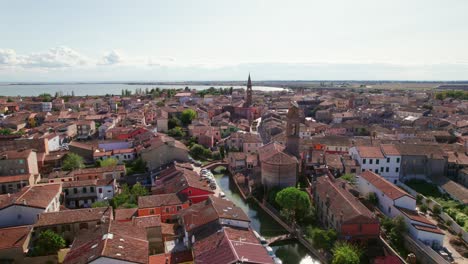 comacchio, italy, drone move up view of urban infrastructure, little italian city, sunny weather