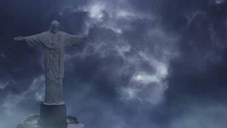 jesus statue on dark cloud background