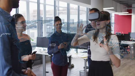 Animation of financial data processing over caucasian businesswoman using vr headset in office
