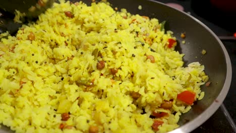 top view of fresh indian breakfast, preparing poha with veggies and ingredients in cooking pan