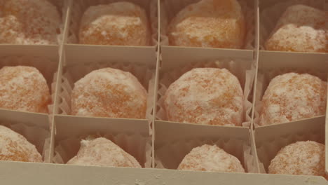 box of orange sugar-coated candies