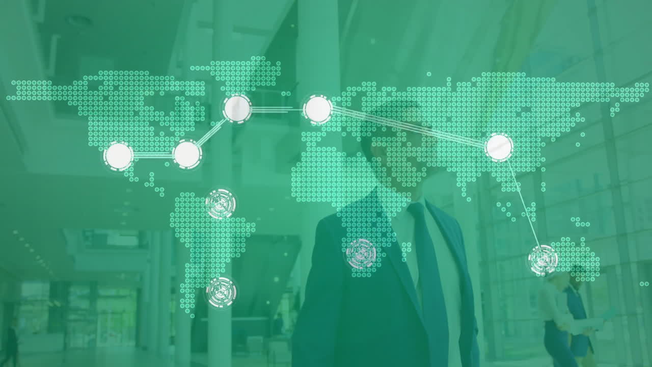 Businessman standing in lobby, showing smartphone icon with technology map and network nodes