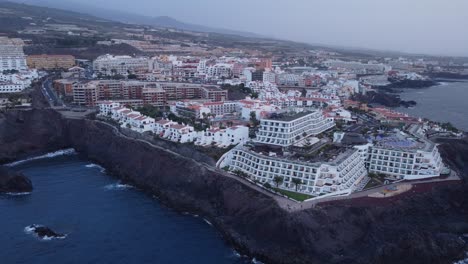 costa adeje tenerife spain canary islands aerial footage hotels resort vacation sunset waves black rocks