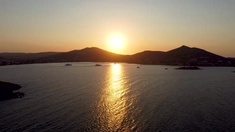 epic sunset landscape of monastery beach in paros, greece
