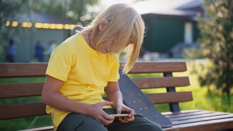 boy using smartphone outdoors