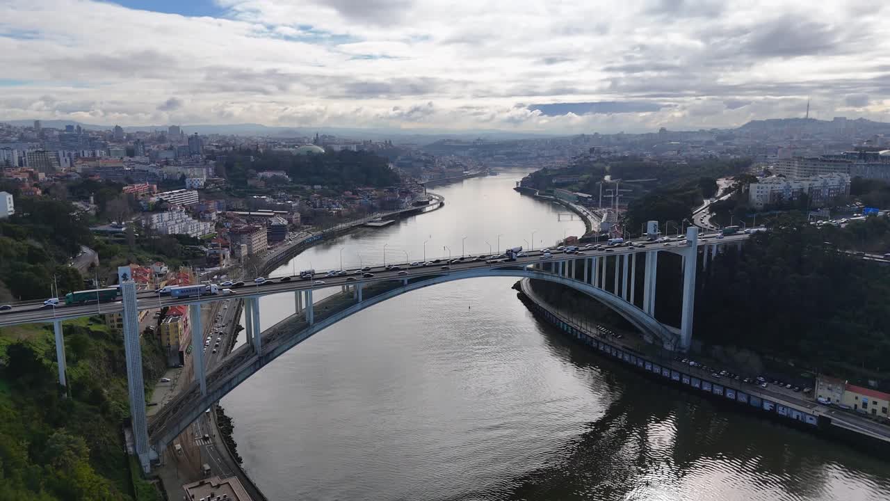 Aerial footage showing Porto bridge traffic and Douro River