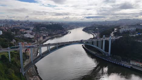 aerial footage showing porto bridge traffic and douro river