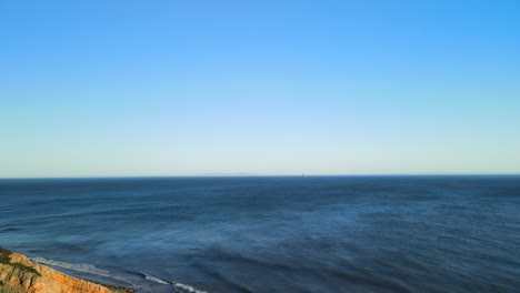 Aerial-ascend-along-railroad-trestles-with-stunning-blue-turquoise-ocean-water-stretching-to-horizon