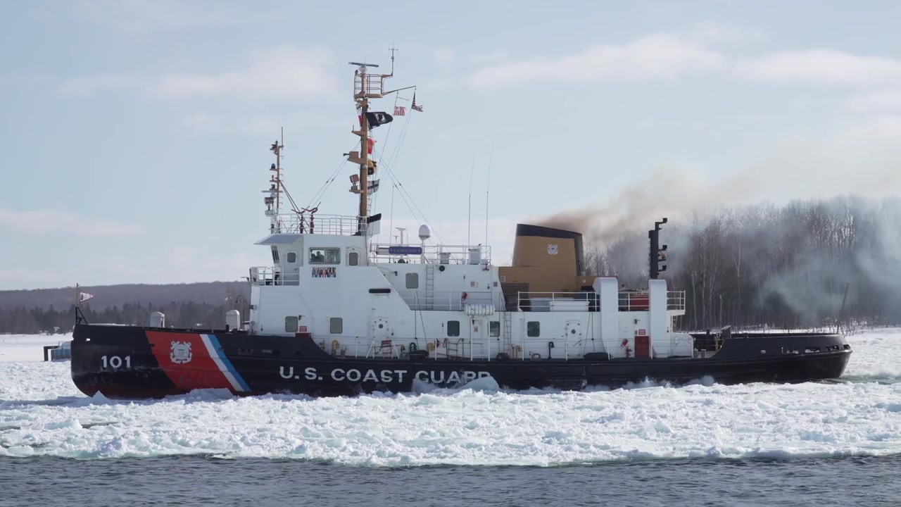 Panning slow motion of US Coast Guard ice breaker in the Great Lakes area