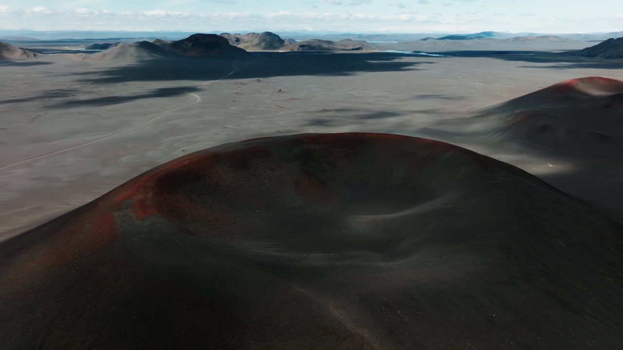 Low-altitude drone flight near the middle of three red volcanic craters in Iceland Part 2