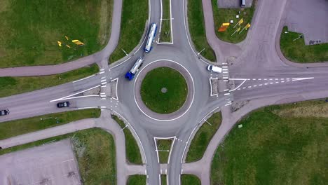 top-down view over traffic intersection with roads and a roundabout