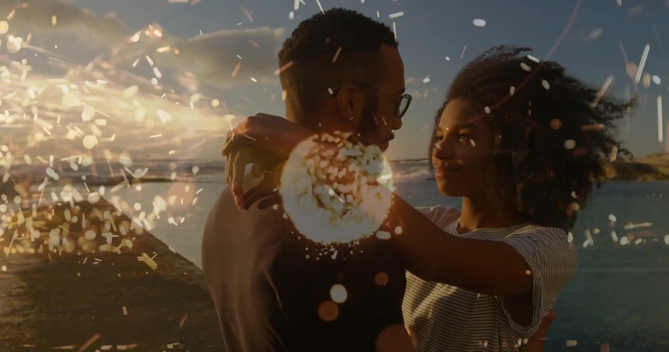 Couple facing close starting kiss embracing on pier sunset, romance bokeh sparks showing affection