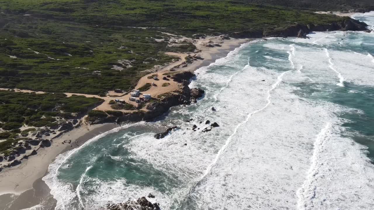 massive waves on sardinia's northwest coast in rena majore, nice weather (with drone)