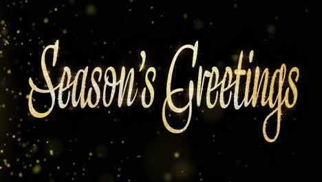 season's greetings: glittery gold text on black background