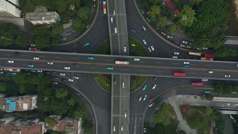 cloudy day guangzhou city center traffic street road junction aerial topdown panorama 4k china