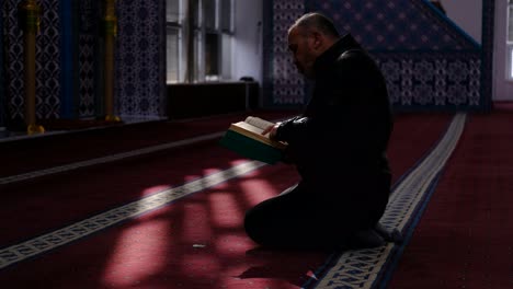 man reads quran in mosque 3