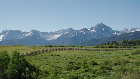 Farmland-with-wooden-fence-and-the-San-Juan-Mountains-in-southwestern-Colorado