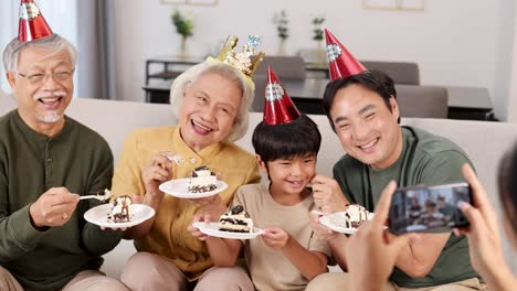 a joyful family captures a birthday moment with cake and smiles, set in a cozy living room