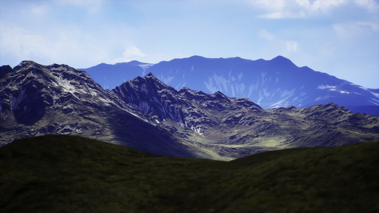 Majestic mountain landscape with rolling hills under a clear sky