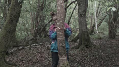 girl in forest with 90's jacket marks trail not to get lost