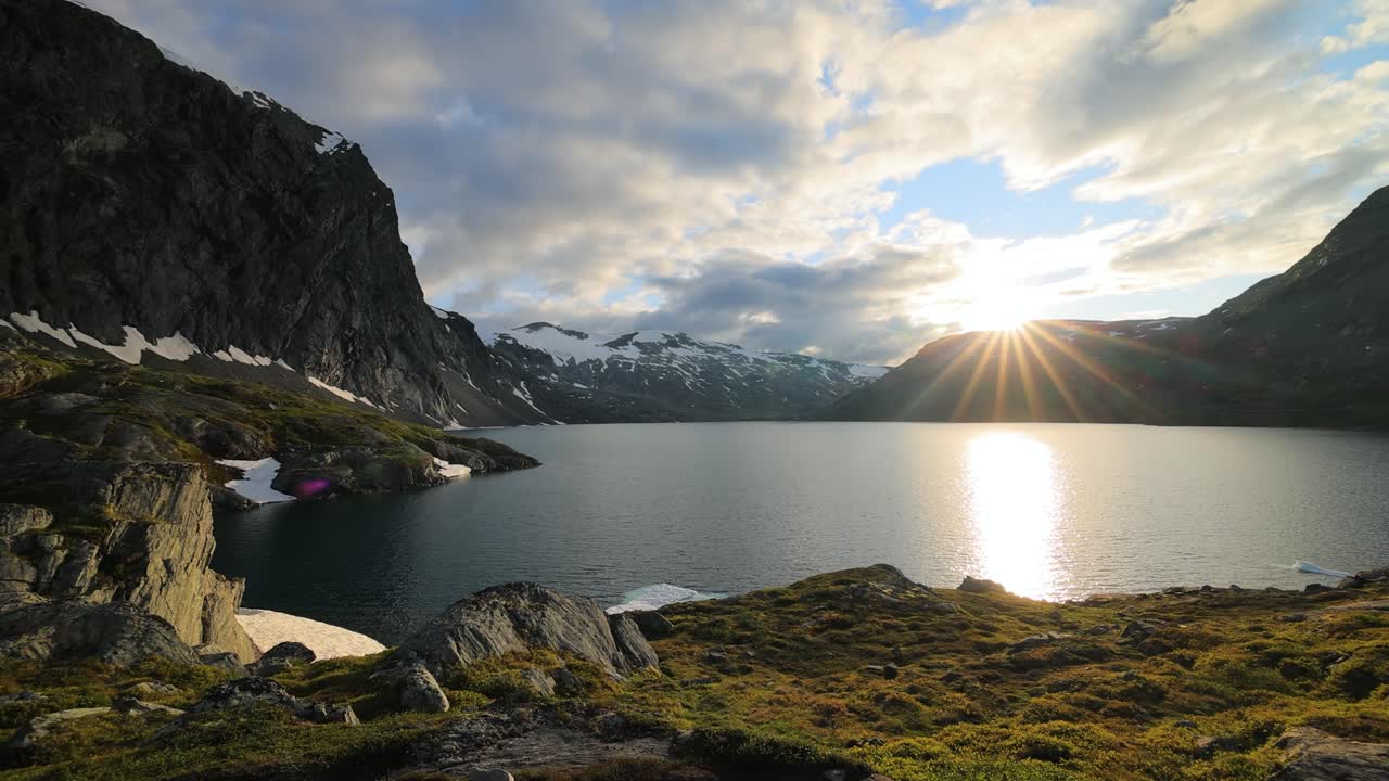 Sunset against the backdrop of the Norwegian mountains. Beautiful Nature Norway natural landscape.