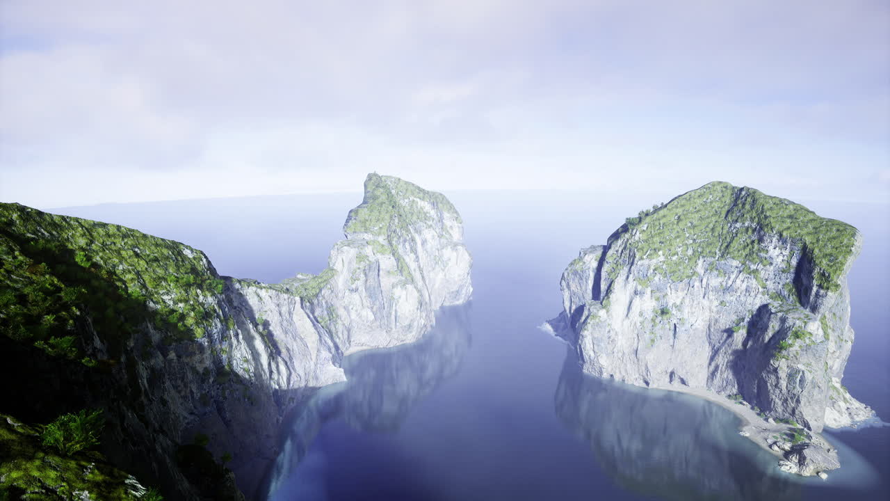 Majestic coastal cliffs rise above tranquil waters in a serene landscape