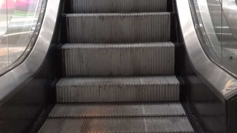 empty moving escalator steps in a building
