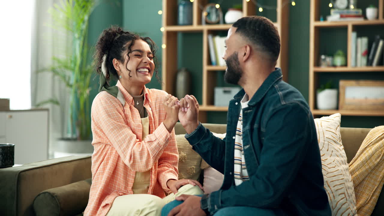 Affectionate Couple Sharing a Joyful Moment with a Pinky Swear at Home
