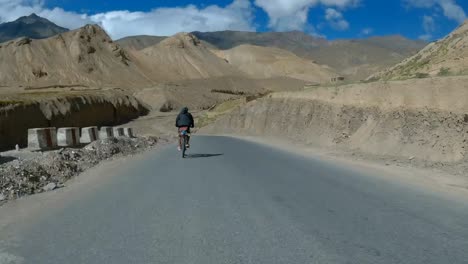 biker speeding on the mountain curssing road to leh in ladakh, india - rolling shot